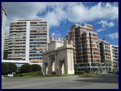 Plaça de la Porta de la Mar with the Arch of Triumph and modern highrise buildings